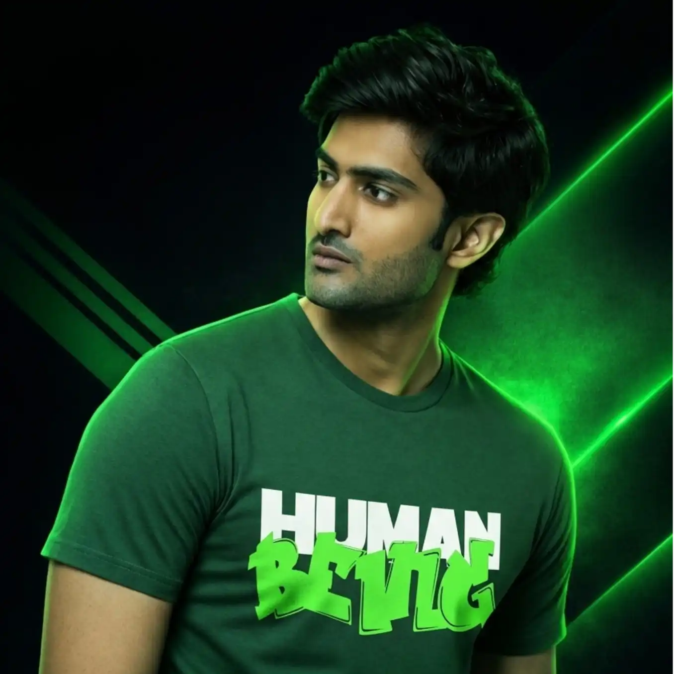 Person wearing a green t-shirt with 'HUMAN BEING' text on a dark background with green accents