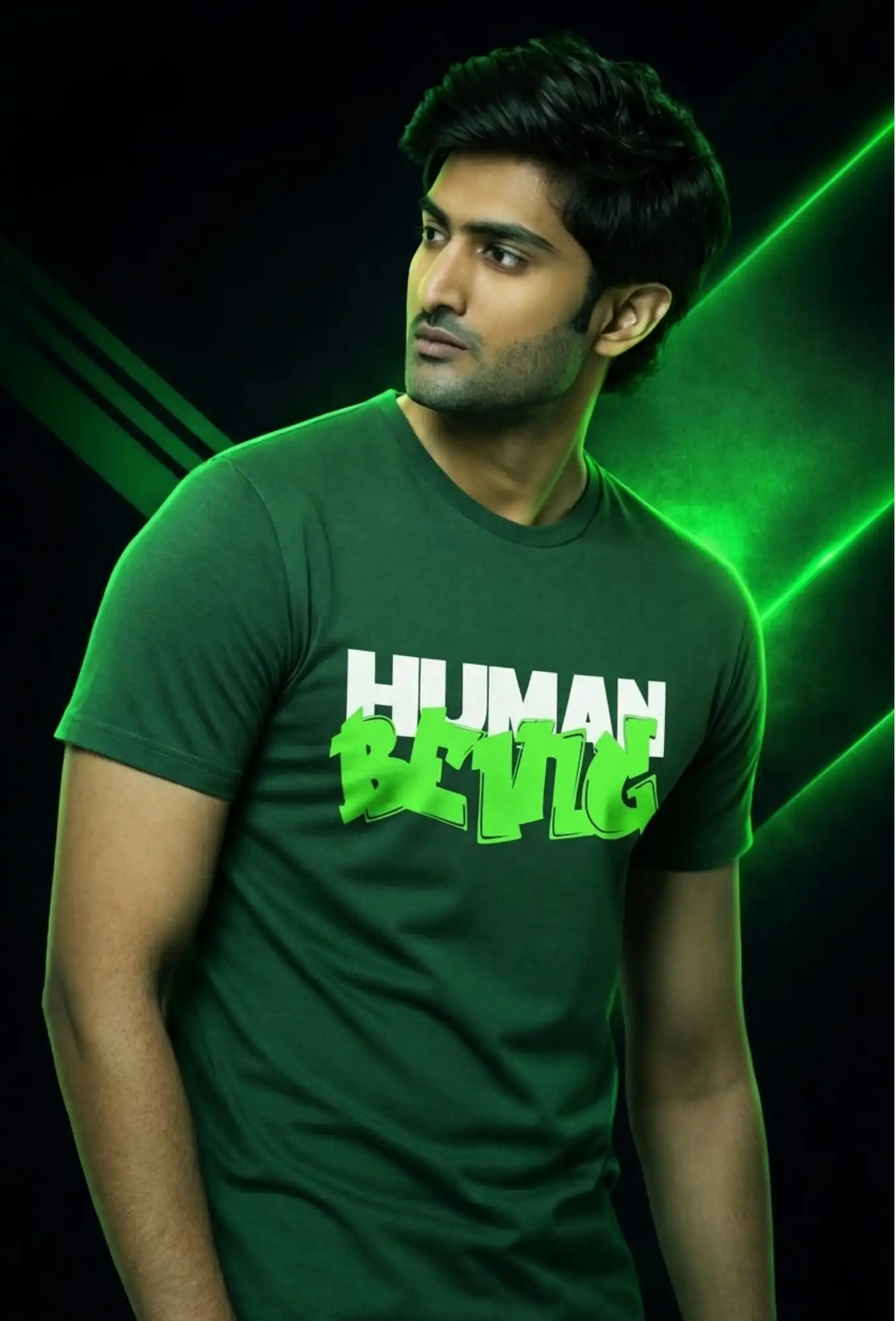 Man wearing a green t-shirt with 'HUMAN BEING' printed on it against a dark background with green accents.
