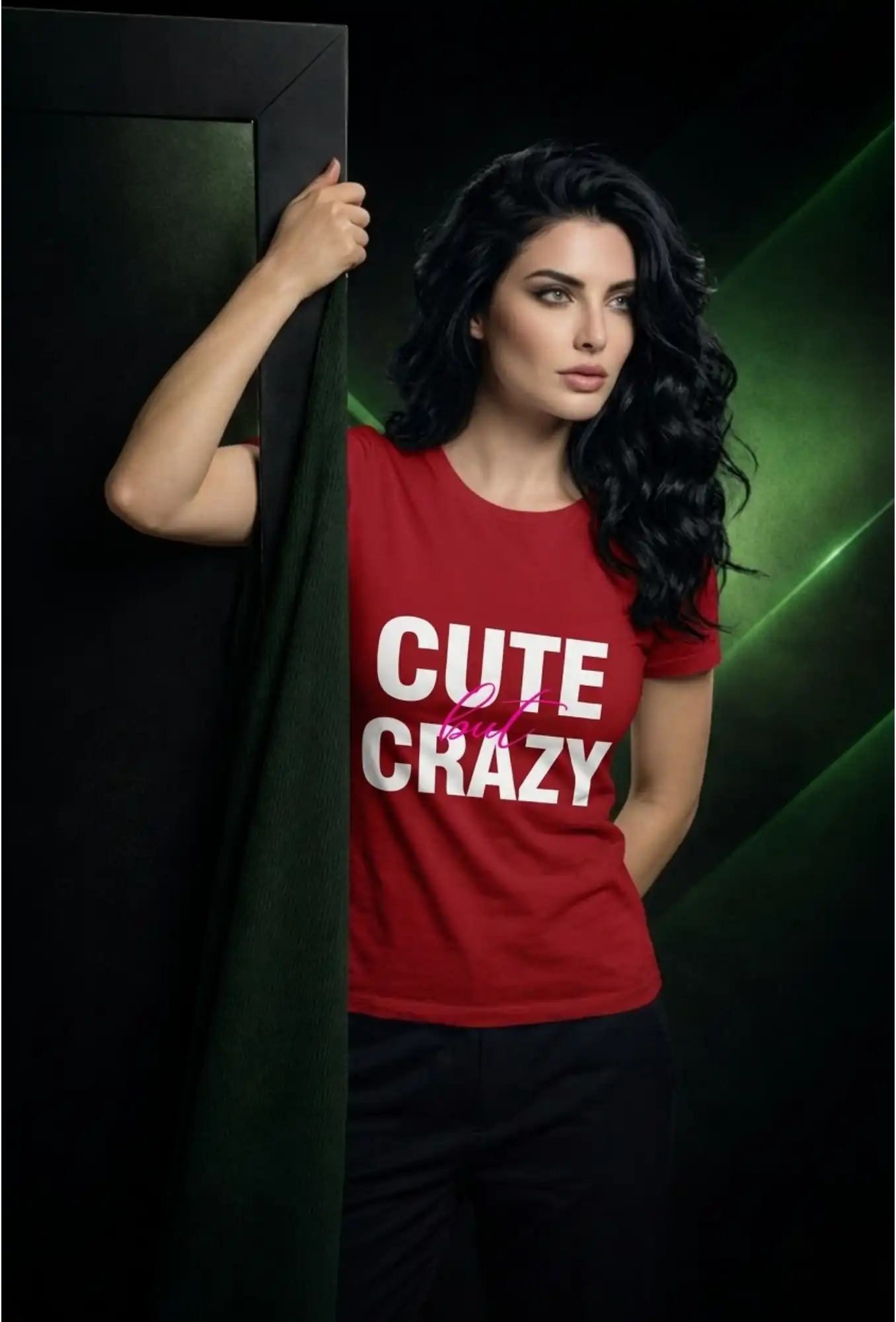 Woman wearing a red t-shirt with 'CUTE CRAZY' text, standing against a dark background.
