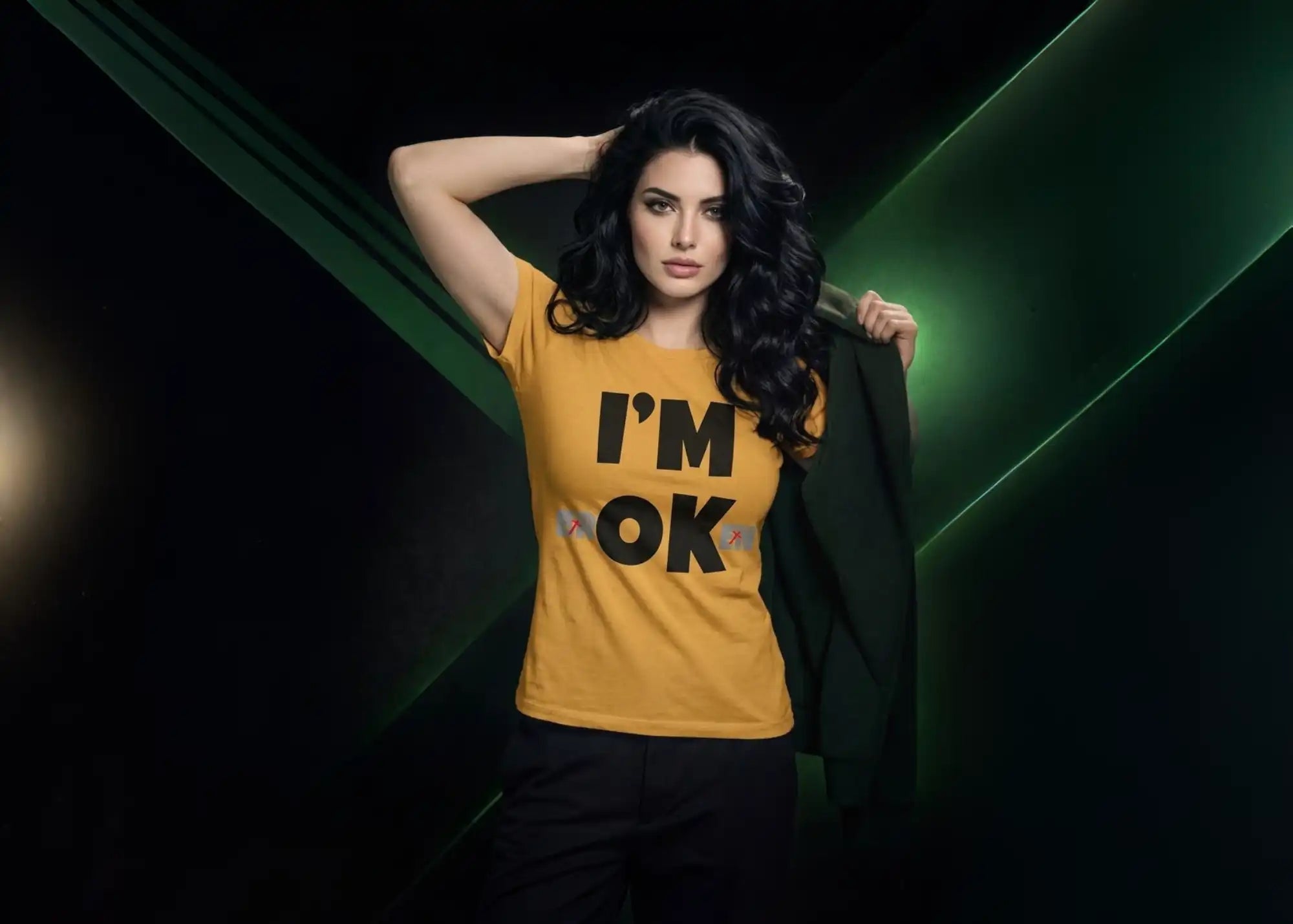 Woman wearing a yellow t-shirt with 'I'm OK' text against a dark background