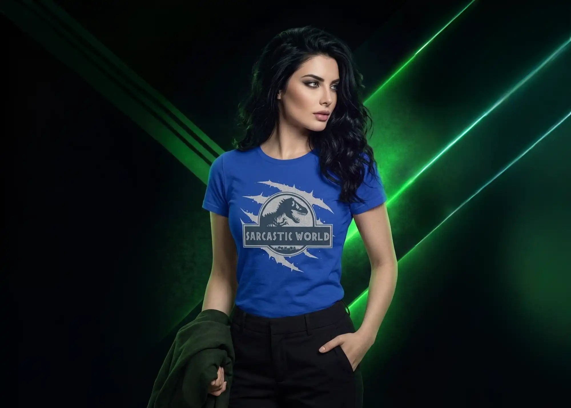 Woman wearing a blue t-shirt with a graphic design on a dark background